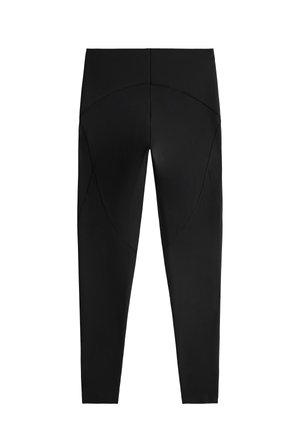 Črne legice z gladko teksturo, s ukrivljenim šivom na zadnji strani, dolžina do gležnjev in elastiko v pasu.