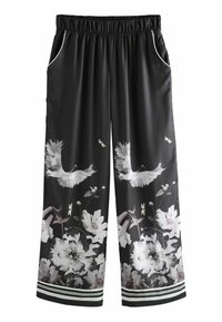 Pantaloni largi negri dintr-un material neted, cu imprimeuri florale și de păsări, talie elastică, buzunare laterale și accente în dungi.