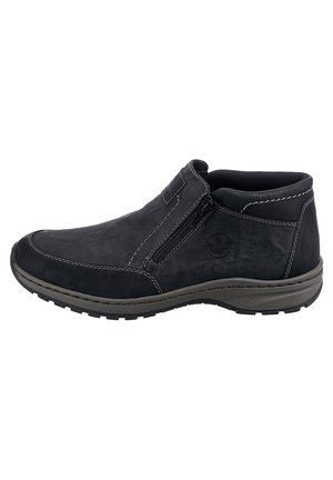 Chaussures noires en cuir à enfiler avec fermeture éclair, coutures contrastées, bout arrondi et semelle en caoutchouc texturé pour une meilleure adhérence.