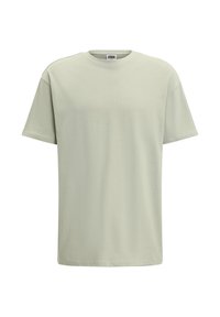 Jasnozielony bawełniany T-shirt z klasycznym okrągłym dekoltem i krótkimi rękawami. Gładka tekstura, bez wzorów i dodatkowych elementów.