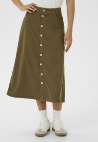 Olive green corduroy midi skirt with front button closure, pockets, and a straight cut. Features vertical ridges and metal buttons.