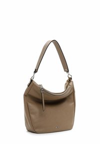 Sac à main en cuir tan avec une forme incurvée, une bandoulière réglable, des détails de fermeture éclair en argent et un logo discret à l'avant.