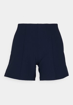 Pantaloni corti blu navy realizzati in tessuto elasticizzato. Presentano una vita alta, un taglio sartoriale e cuciture nascoste. Nessuna tasca visibile né decorazioni.