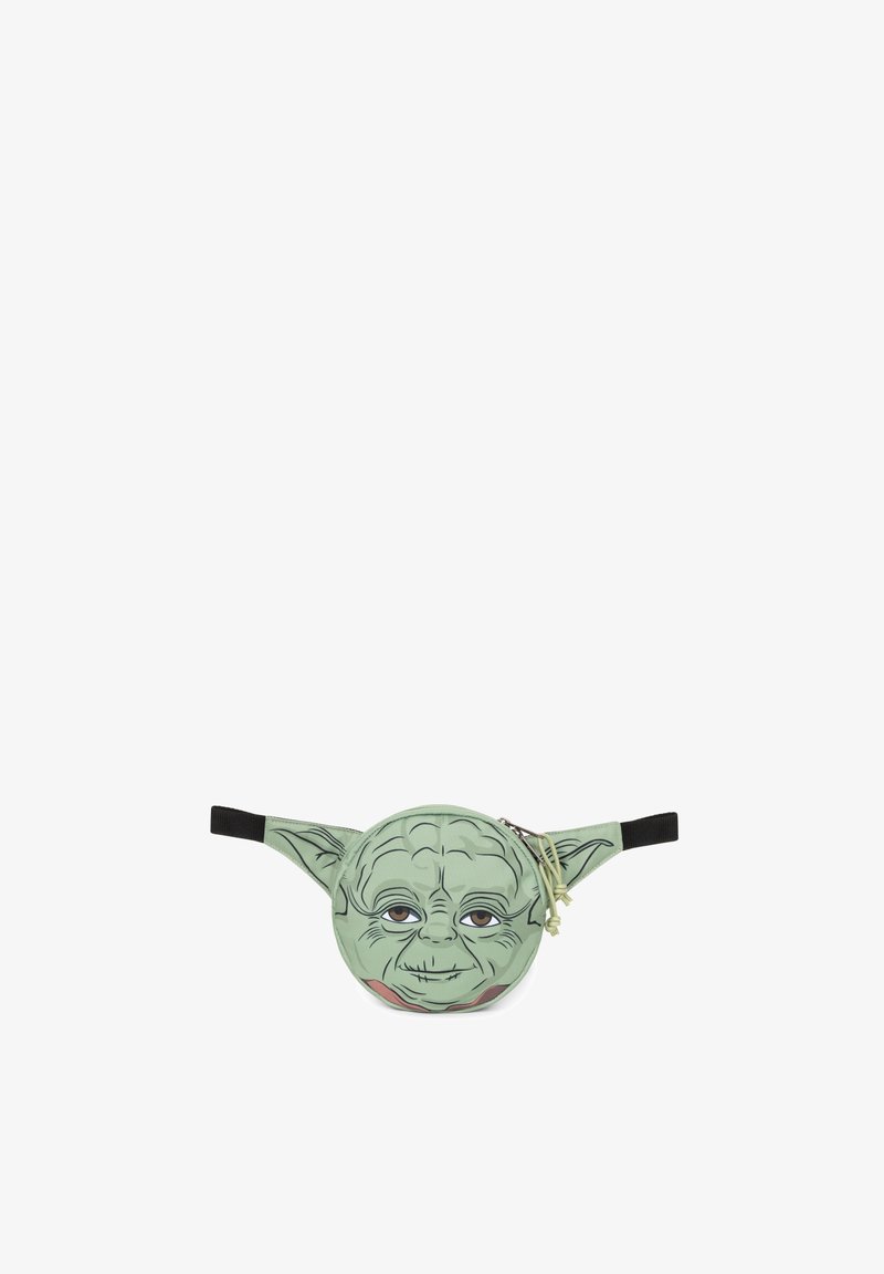 Vihreä vyölaukkua, jossa on sarjakuvamainen Yoda-naamadesign. Pyöreä muoto mustilla säädettävillä hihnoilla ja vetoketjukiinnitys. Huomionarvoisiin kasvojen yksityiskohtiin kuuluvat suuret silmät ja terävät korvat.