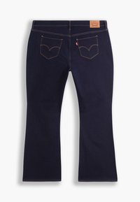 Jean évasé bleu foncé avec une texture lisse, des surpiqûres orange contrastantes et deux poches arrière avec un motif courbe signature.