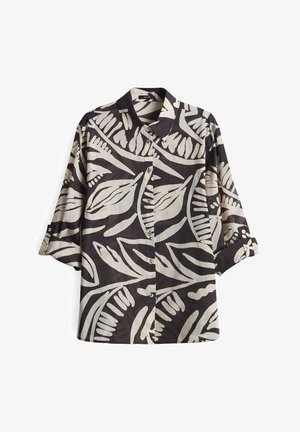 Chemise à manches courtes noire et crème avec un motif de feuilles audacieux. Fabriquée en tissu léger, elle est dotée d'un col classique et de boutons.