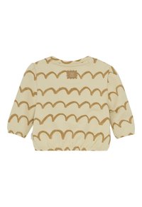 Crème-kleurig langslievend baby shirt met lichtbruine golvende strepen en elastische manchetten, met een kleine bruine patch bij de kraag.