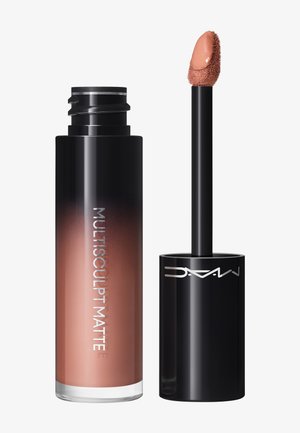 Tube de rouge à lèvres liquide en ombré noir à nude ouvert, étiqueté "Multisculpt Matte" avec un applicateur incliné montrant un rouge à lèvres mat nude.