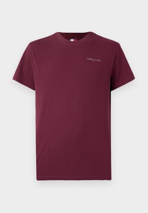 T-shirt de algodão bordeaux com mangas curtas e decote redondo. Apresenta um pequeno logotipo branco "TOMMY JEANS" no peito.