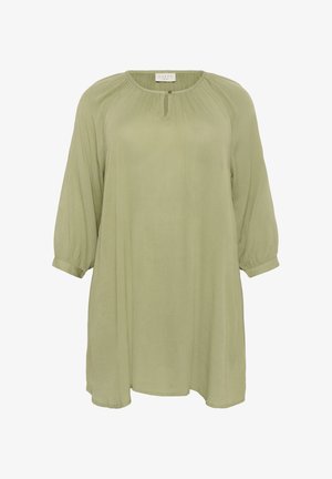 Olivno zelena tunika s krojem, okruglim izrezom, gumbnimi detalji in rukavima do tri četvrtine. Mehak, lahek material z elegantnim krojem.