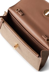 Brown leather bag with a textured beige panel. Features a gold zipper and hardware accents. Interior compartments visible, with a zip pocket.