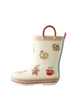 Botte de pluie en caoutchouc blanche ornée d'autocollants colorés sur le thème des fêtes, d'une poignée rouge, d'un contour marron clair et d'une semelle texturée pour une meilleure adhérence.