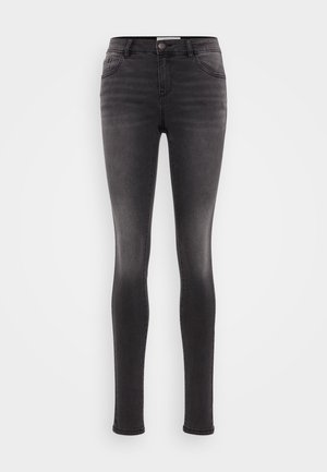 Sorte skinny jeans i denim, med klassisk fem-lommers design, glidelås og en lett falming på bena. Glatt tekstur.