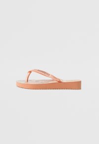 Pink rubber flip-flop sandal with a textured sole and an embossed logo. Features a thin toe post and a flat, durable sole.