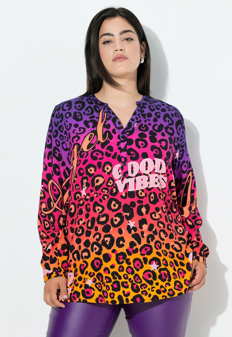 Long-sleeve shirt featuring purple to orange gradient leopard print and "GOOD VIBES" text, made of lightweight fabric with a relaxed fit.