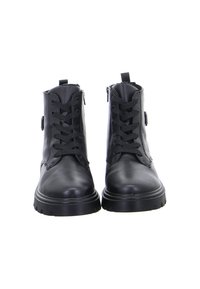 Pair of black leather ankle boots with thick soles, front laces, side zippers, and pull tabs, photographed from the front on a white background.
