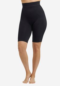 Shorts modellanti neri a vita alta in tessuto elastico, con design senza cuciture, lunghezza a metà coscia e una texture liscia.