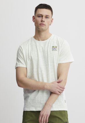 White cotton t-shirt with a textured finish, featuring a small colorful palm tree graphic on the left chest, crew neck design.