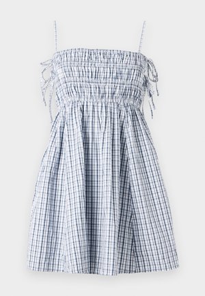 Blå og hvit rutete kjole med strammet liv, tynne stropper og en luftig skjørt, laget av lettvektstoff. Har snøring detaljer.