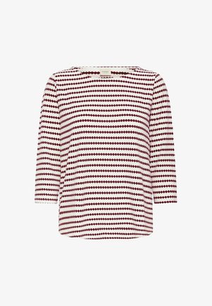 Haut blanc à manches longues trois-quarts, col rond, avec des rangées horizontales de petits points ovales bordeaux.