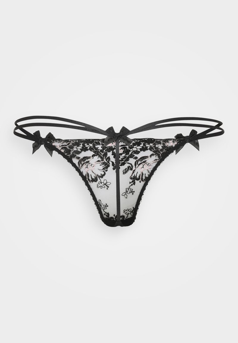 Perizoma in pizzo nero con ricami floreali, caratterizzato da rete trasparente e fiocchetti decorativi sulla vita. Le bretelle regolabili migliorano la vestibilità e il design.