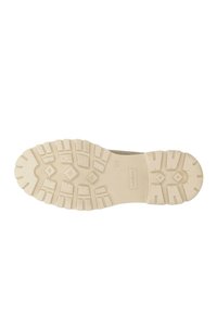 Suola in gomma beige con un pattern di battistrada robusto, dotata di lugs prominenti per una migliore aderenza e una sezione centrale liscia e testurizzata. Logo del marchio impresso.