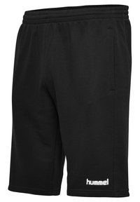 Svarta idrottsshorts i mjukt tyg, med resårmidja, sidfickor och en vit logotyp vid nederkanten.