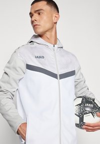 JAKO ICONIC - Spordijakk - weiß/soft grey/anthra light