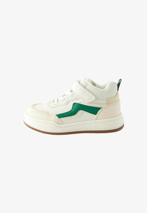 White sneaker with green accents. Features textured leather, a high-top design, lace and Velcro closure, and a brown rubber sole.