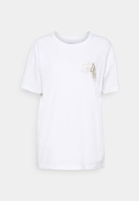 Hvid t-shirt med korte ærmer lavet af bomuld, med en diskret brodering af blomster og bogstaver på venstre bryst. Løs pasform med rund halsudskæring.