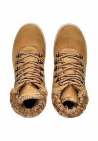 Tan leather ankle boots with faux fur lining, round toe, metal eyelets, and beige laces. Textured upper and soft cuff detailing.