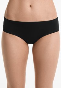 Zwarte bikini slipjes met een gladde textuur en een elastische tailleband, met een eenvoudig, naadloos ontwerp en een medium hoge snit.