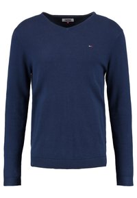 Mörkblå långärmad V-ringad tröja med liten Tommy Hilfiger-logga på vänster bröst, ribbade manschetter och fåll.