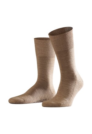 Hellbraune Socken mit gerippten Bündchen, hergestellt aus weichem, strukturiertem Material. Sie haben eine glatte Oberfläche und ein klassisches Design in Crew-Länge.