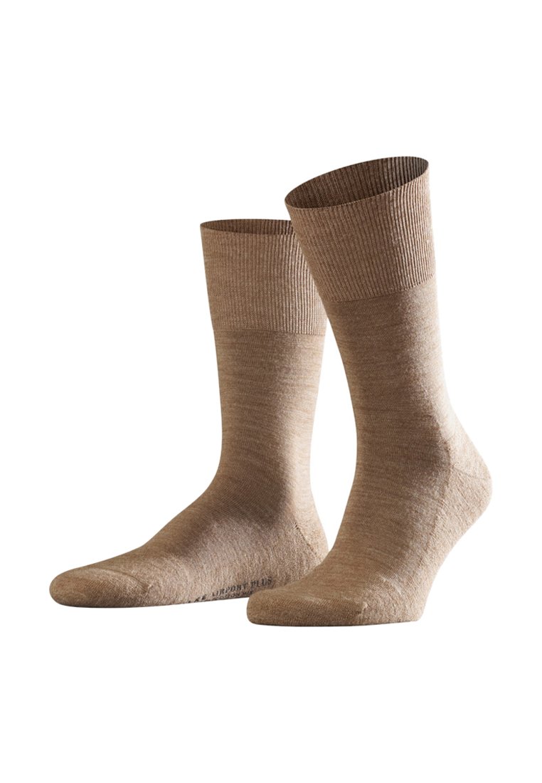 Hellbraune Socken mit gerippten Bündchen, hergestellt aus weichem, strukturiertem Material. Sie haben eine glatte Oberfläche und ein klassisches Design in Crew-Länge.