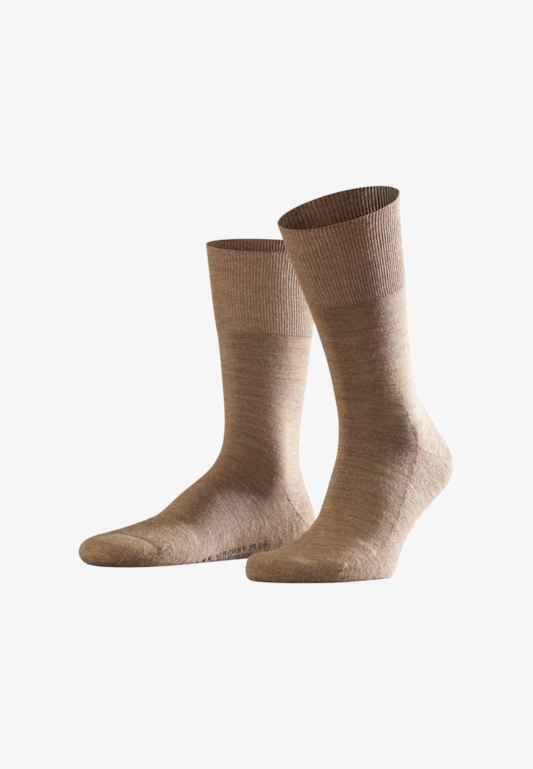 Hellbraune Socken mit gerippten Bündchen, hergestellt aus weichem, strukturiertem Material. Sie haben eine glatte Oberfläche und ein klassisches Design in Crew-Länge.