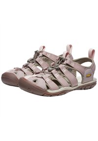 Light pink open-toe sandals with multiple adjustable straps, a durable rubber sole, and a textured insole for grip and comfort.