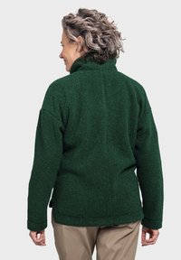 Grüne Fleecejacke mit hohem Kragen, strukturiertem Material und entspannter Passform. Verfügt über lange Ärmel und eine Rückennaht.