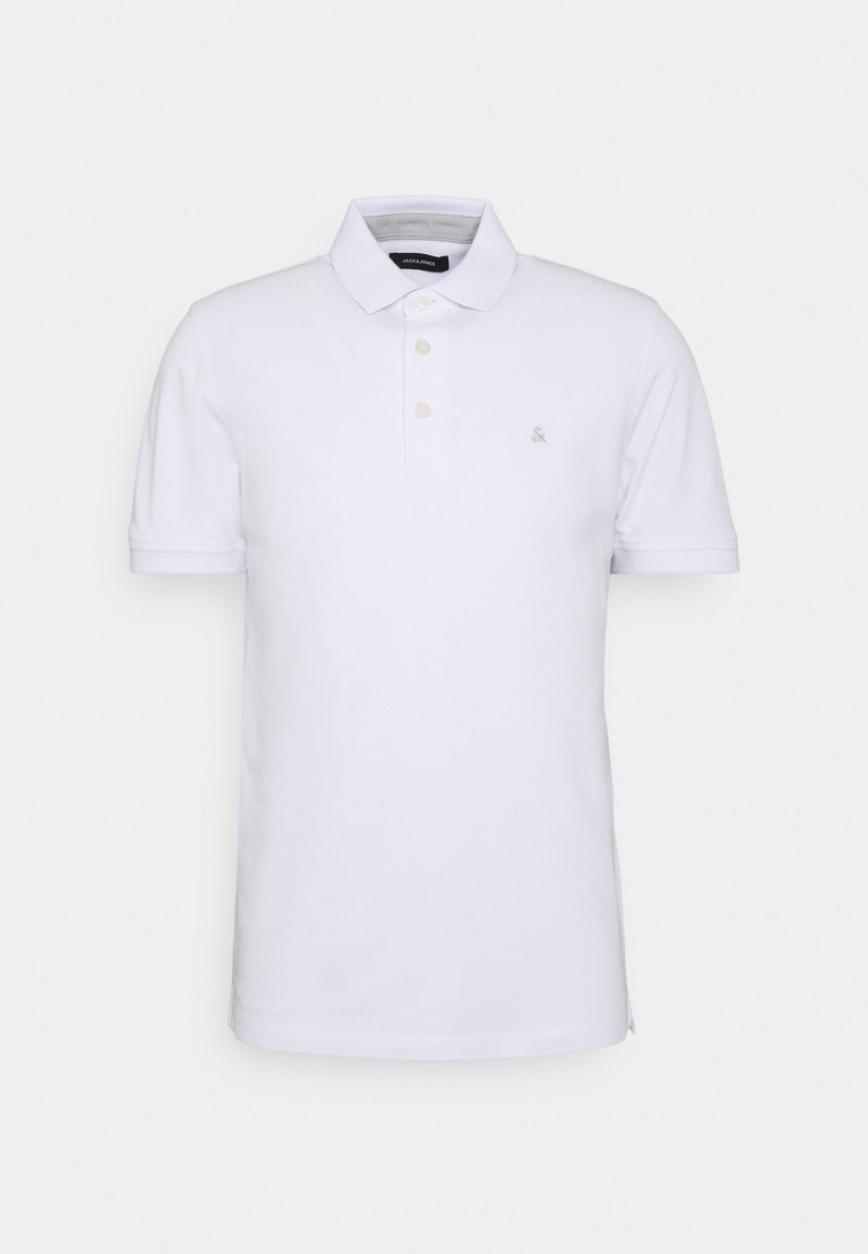 Witte polo met een zachte textuur, korte mouwen, een kraag en een placket met drie knopen. Voorzien van een klein logo op de borst.