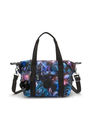 Floral-patterned fabric bag in deep blue and purple hues. Features black handles, adjustable strap, zipper pockets, and pom-pom keychain detail.