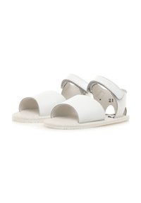 Sandalias de cuero blanco con punta abierta, suela blanda, correas ajustables de Velcro y cortes laterales para mayor transpirabilidad. Talla 21.