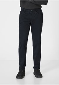 Navy blue chinos with a slim fit, featuring five pockets and a button closure. Fabric appears smooth with a slight sheen. Suitable for casual wear.