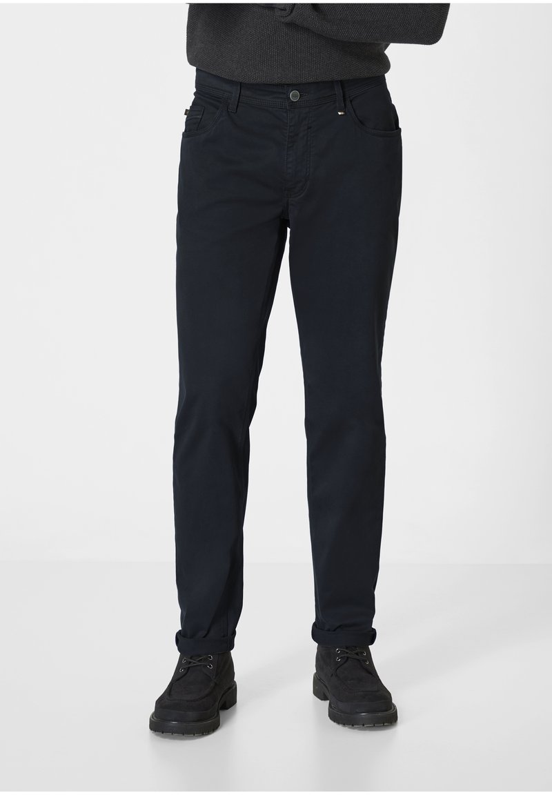 Navy blue chinos with a slim fit, featuring five pockets and a button closure. Fabric appears smooth with a slight sheen. Suitable for casual wear.