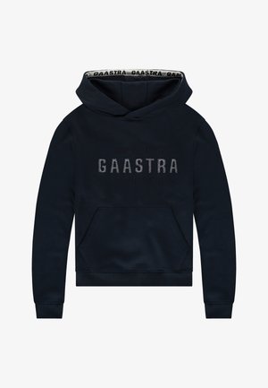 Sudadera azul marino con bolsillo frontal, con el logo elevado de "GAASTRA" y coordenadas geográficas. Tejido suave con puños y dobladillo acanalados.