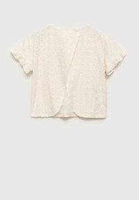 Top bianco a maniche corte con tessuto testurizzato, caratterizzato da un'apertura sul retro e orlo arrotondato. Decorato con piccoli motivi circolari in tutta la superficie.