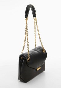 Black leather handbag with a structured design, gold metal chain strap, and a folded top. Features a rectangular shape and smooth texture.