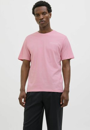 Baumwoll-T-Shirt in zartem Pink, mit kurzen Ärmeln und Rundhalsausschnitt. Enthält ein kleines weißes "PREMIUM"-Logo auf der Brust.
