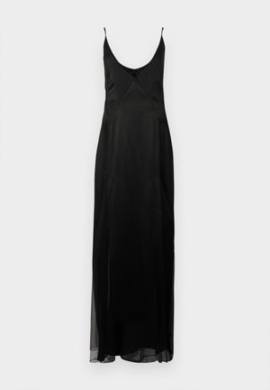 Vestido de satén negro tipo slip con tirantes finos, escote en V profundo y silueta A lineal de longitud completa. Presenta una textura de lunares y una abertura frontal.