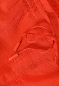 TATUUM NAMALIKO - Broek - orange