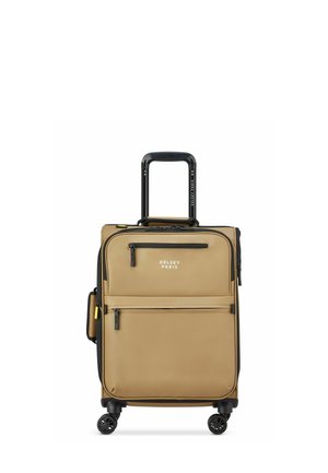 Valise beige avec double zip, poche frontale et éléments en noir. poignée rétractable et quatre roues pour une maniabilité optimale. Marque Delsey Paris.